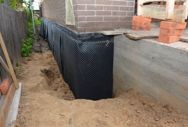 SJ Waterproofing Pros technician performing targeted Interior Drainage System assessment in Leon, KS